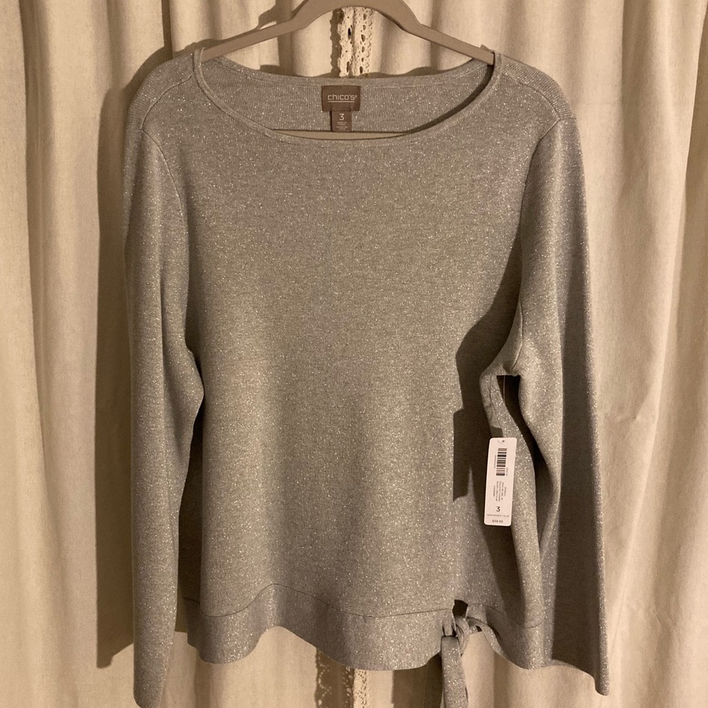 Brand New Shimmery Silver Gray pull over sweater with front tie by Chico’s